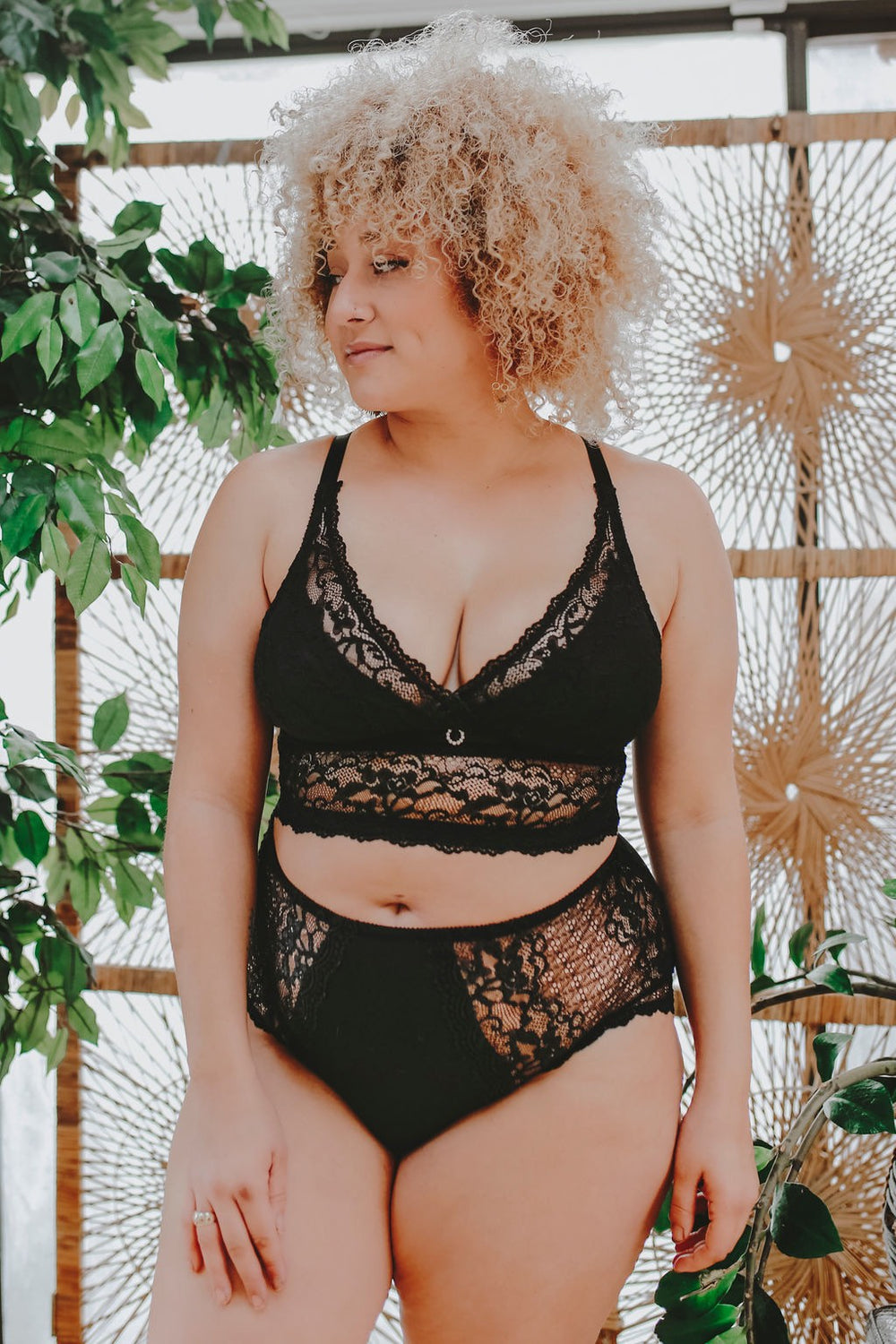 Black lace longline bra with a low plunging neckline, designed by Mayana for fuller-busted women.